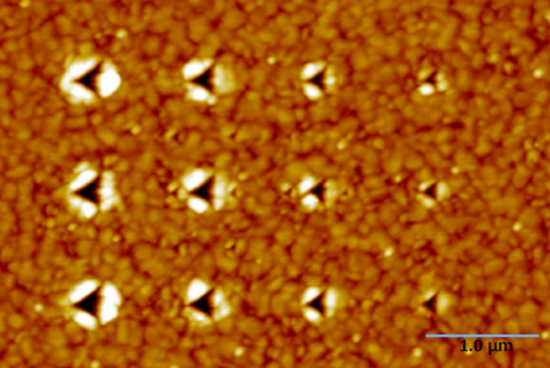 Nanoindentation on a gold thin film using four different forces of about 50, 40, 30, and 20 µN respectively with three indents made at each force.